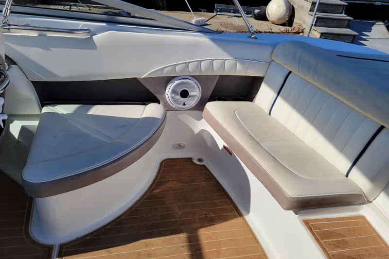 Slide: The Image of Interior seating of a 2005 Cobalt 255 boat with wood flooring. - 8
