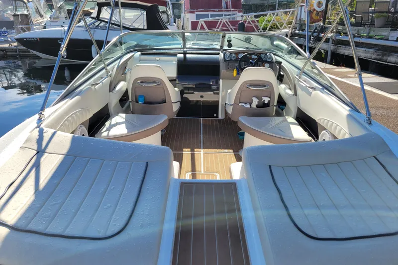 Slide: The Image of Interior view of a 2005 Cobalt 255 boat, featuring spacious seating and a sleek dashboard. - 4