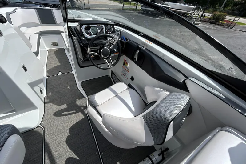 Slide: The Image of 2023 Scarab 255 Wake ID boat interior with sleek dashboard and comfortable seating. - 10