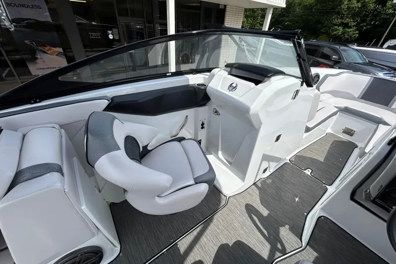 Slide: The Image of 2023 Scarab 255 Wake ID boat interior with sleek seating and modern dashboard design. - 11
