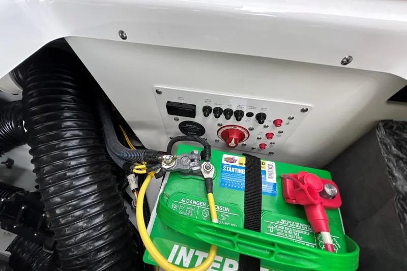 Slide: The Image of 2023 Scarab 255 Wake ID boat battery and control panel setup. - 16