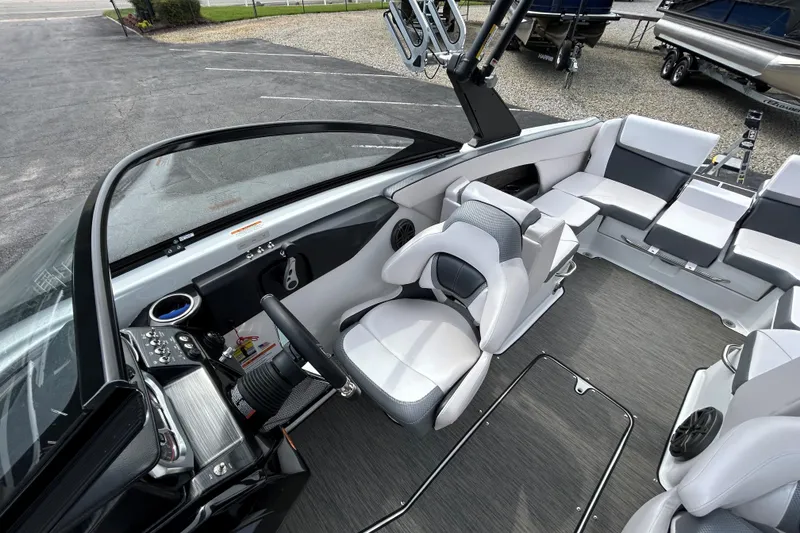 Slide: The Image of 2023 Scarab 255 Wake ID boat interior with modern seating and sleek dashboard design. - 19