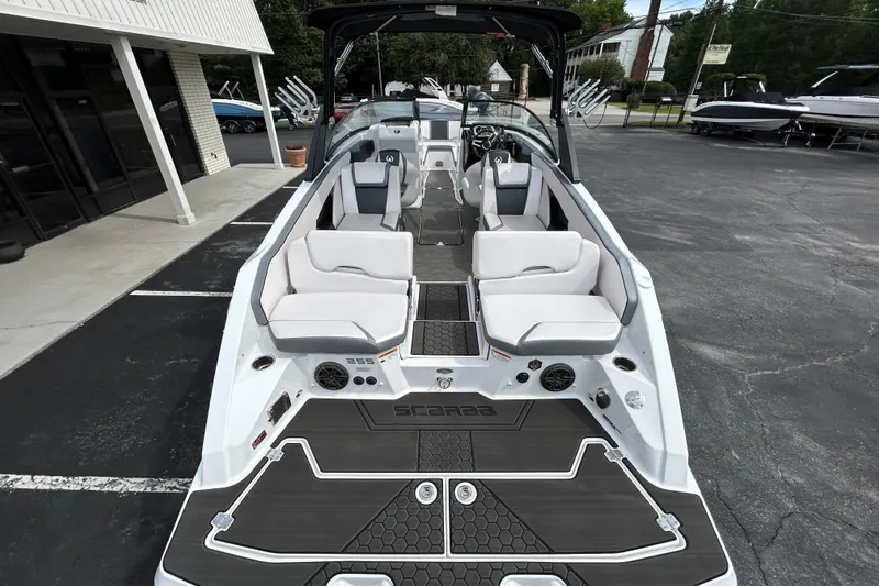 Slide: The Image of 2023 Scarab 255 Wake ID boat with sleek interior design and modern seating arrangement. - 24