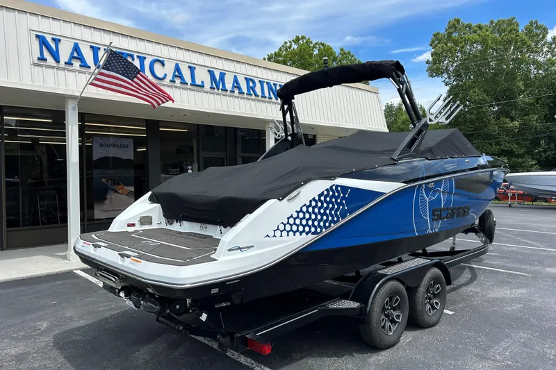 Slide: The Image of 2023 Scarab 255 Wake ID boat on trailer at Nautical Marine dealership. - 32