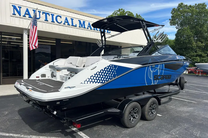 Slide: The Image of 2023 Scarab 255 Wake ID boat displayed at Nautical Marine dealership. - 5