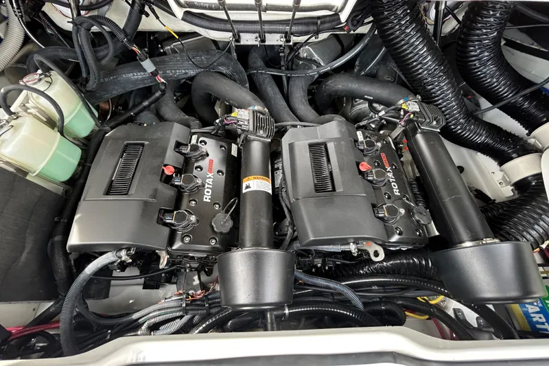 Slide: The Image of Engine compartment of 2023 Scarab 255 Wake ID boat, featuring dual Rotax engines. - 6