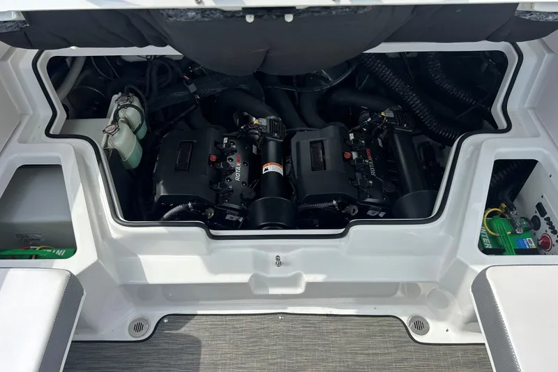 Slide: The Image of Engine compartment of 2023 Scarab 255 Wake ID boat, showcasing dual Rotax engines. - 7
