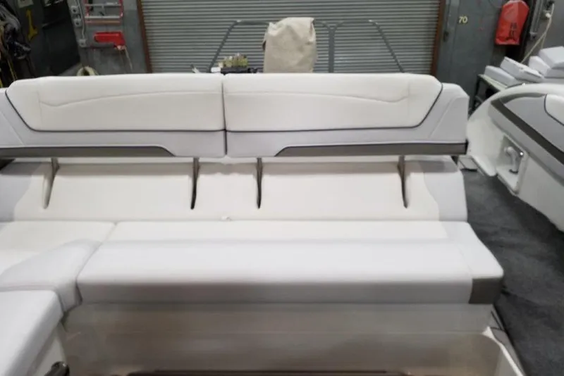 Slide: The Image of 2021 Formula 350 Sun Sport boat interior with white seating and modern design. - 14