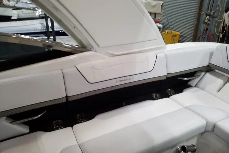 Slide: The Image of 2021 Formula 350 Sun Sport boat interior with white seating and sleek design. - 15