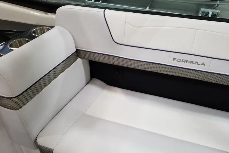 Slide: The Image of 2021 Formula 350 Sun Sport boat interior with white seating and cup holders. - 19