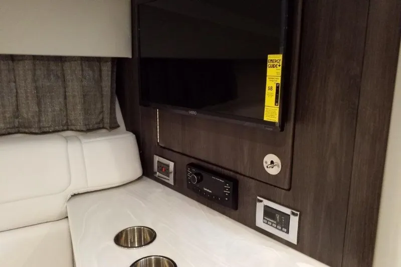 Slide: The Image of Interior of 2021 Formula 350 Sun Sport with TV, control panel, and cup holders. - 21