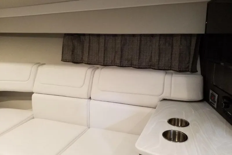 Slide: The Image of Interior of 2021 Formula 350 Sun Sport with white seating and cup holders. - 24