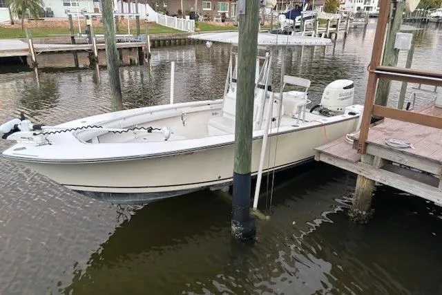 Slide: The Image of 2001 SeaCraft SC 23 Classic boat docked in a marina setting. - 7