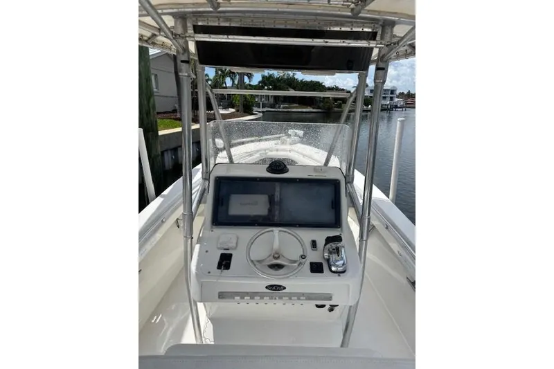 Slide: The Image of 2001 SeaCraft SC 23 Classic boat console with steering wheel and navigation equipment. - 14