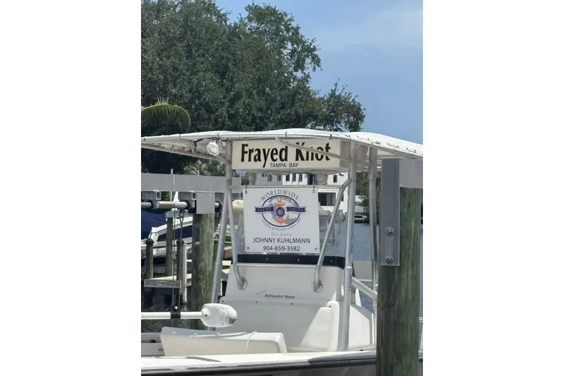 Slide: The Image of 2001 SeaCraft SC 23 Classic boat named "Frayed Knot" docked in Tampa Bay marina. - 16