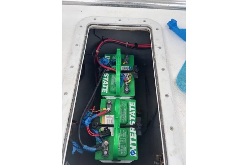 Slide: The Image of Battery compartment of a 2001 SeaCraft SC 23 Classic boat with Interstate batteries. - 19