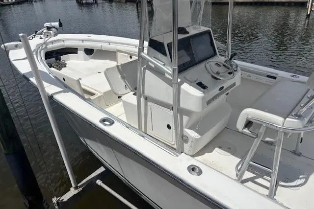 Slide: The Image of 2001 SeaCraft SC 23 Classic boat, white exterior, docked on water, featuring center console design. - 6