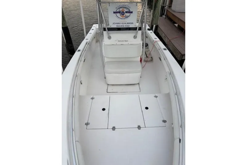 Slide: The Image of 2001 SeaCraft SC 23 Classic boat interior, featuring white seating and spacious deck. - 16