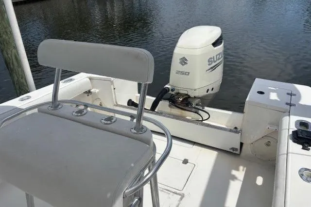 Slide: The Image of 2001 SeaCraft SC 23 Classic boat with Suzuki 250 outboard motor on calm water. - 9