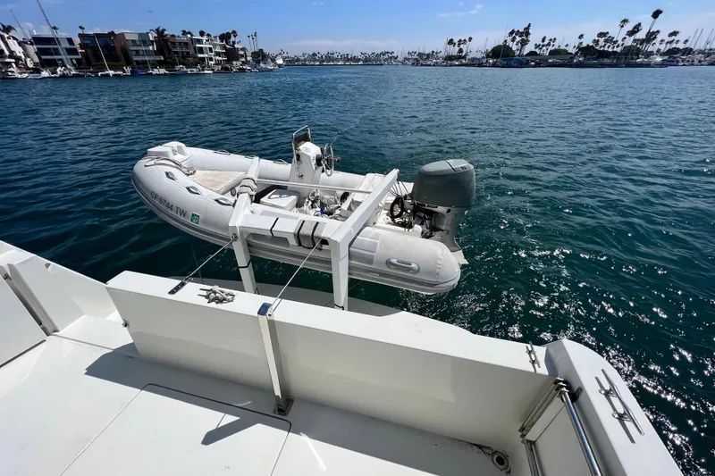 Slide: The Image of Inflatable boat on Navigator 4300 yacht, 1994, docked in sunny marina. - 10