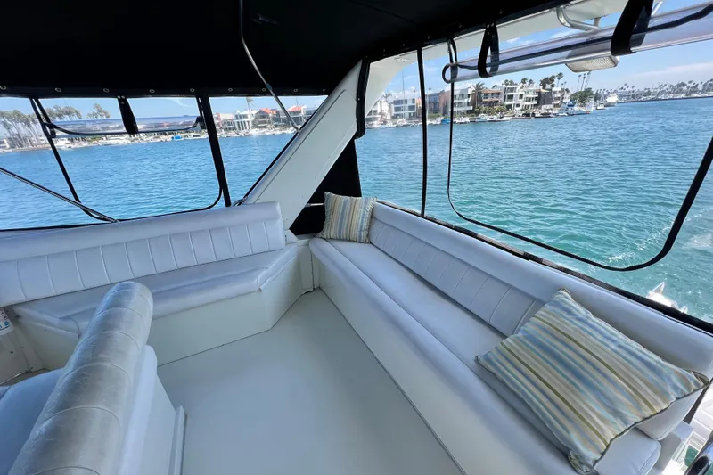 Slide: The Image of Luxurious interior of 1994 Navigator 4300 yacht with waterfront view and comfortable seating. - 11