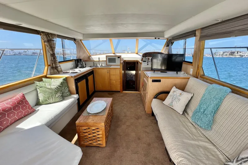 Slide: The Image of Luxurious interior of a 1994 Navigator 4300 yacht with cozy seating and modern amenities. - 14