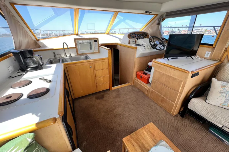 Slide: The Image of Interior of a 1994 Navigator 4300 yacht with kitchen and helm station. - 21