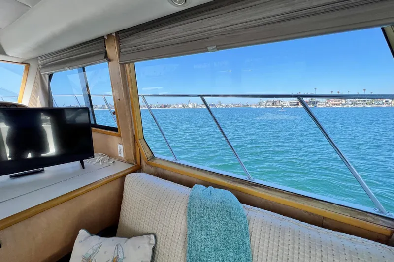 Slide: The Image of Interior view of 1994 Navigator 4300 yacht with ocean scenery through window. - 24