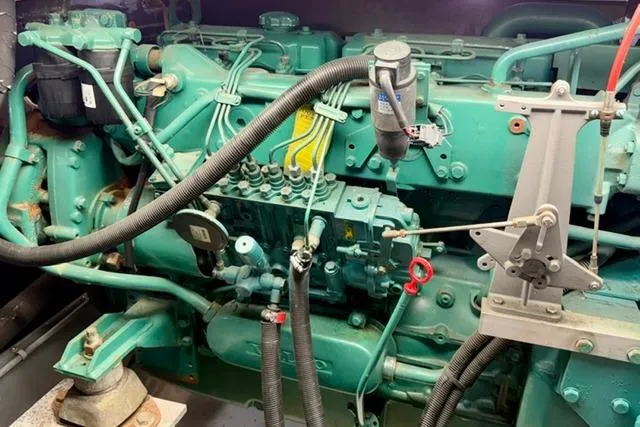 Slide: The Image of Engine of a 1994 Navigator 4300, showcasing intricate mechanical components and hoses. - 42