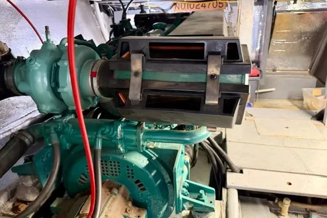 Slide: The Image of Engine compartment of a 1994 Navigator 4300, showcasing mechanical components and wiring. - 43