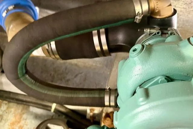 Slide: The Image of Engine component with hoses in a 1994 Navigator 4300. - 45
