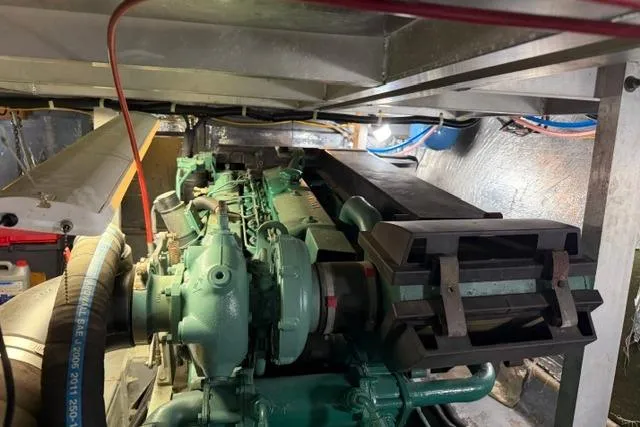 Slide: The Image of Engine compartment of a 1994 Navigator 4300, showcasing mechanical components and wiring. - 46