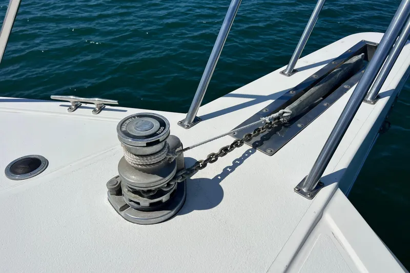 Slide: The Image of Anchor winch on 1994 Navigator 4300 boat deck, with ocean background. - 6