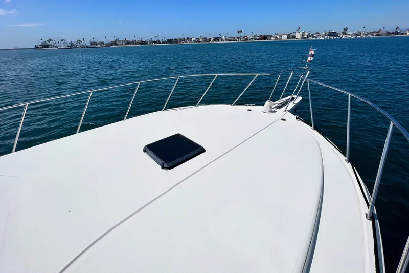 Slide: The Image of Bow view of 1994 Navigator 4300 yacht on calm ocean waters. - 7