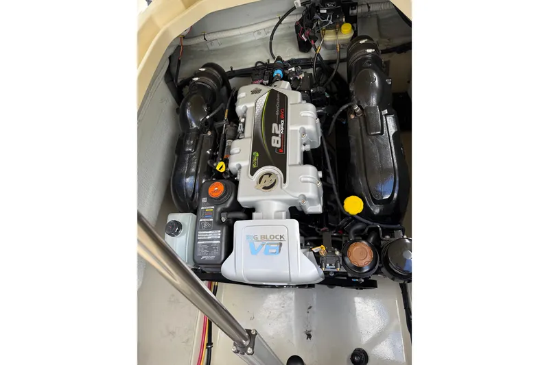 Slide: The Image of Engine compartment of 2019 Chris-Craft Launch 28 GT, featuring a powerful V8 engine. - 13