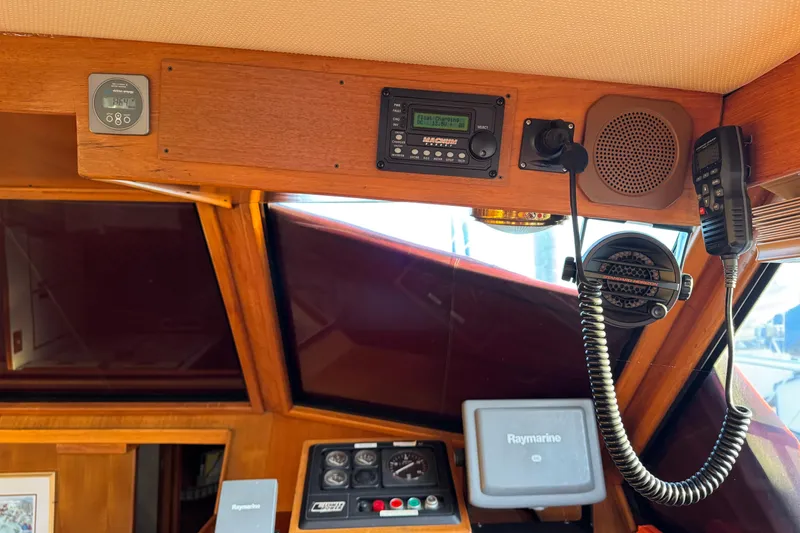 Slide: The Image of Interior of a 1987 President 37 boat cockpit with navigation equipment and communication devices. - 17