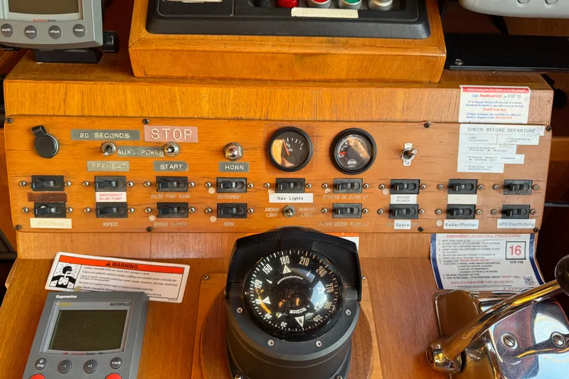 Slide: The Image of Control panel of a 1987 President 37 boat with gauges and switches. - 20