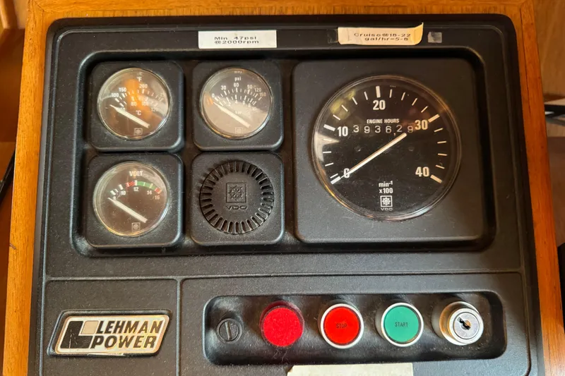 Slide: The Image of Control panel of a 1987 President 37 with Lehman Power gauges and engine hour meter. - 22