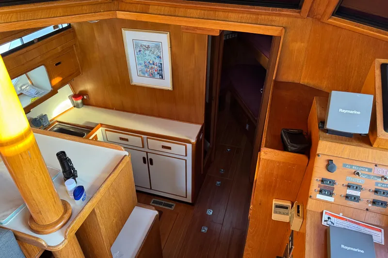 Slide: The Image of Interior of a 1987 President 37 yacht with wood paneling and navigation equipment. - 24
