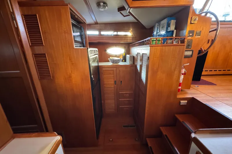 Slide: The Image of Interior of a 1987 President 37 yacht with wooden cabinetry and nautical decor. - 30