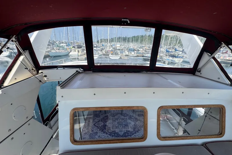 Slide: The Image of Interior view of a 1987 President 37 yacht with marina backdrop. - 70