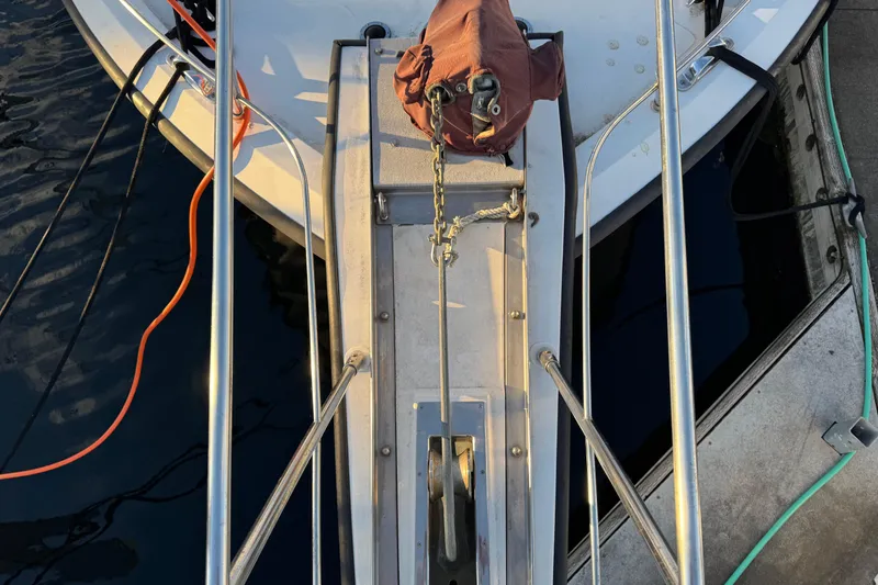 Slide: The Image of Bow of a 1987 President 37 yacht with anchor chain and ropes. - 4