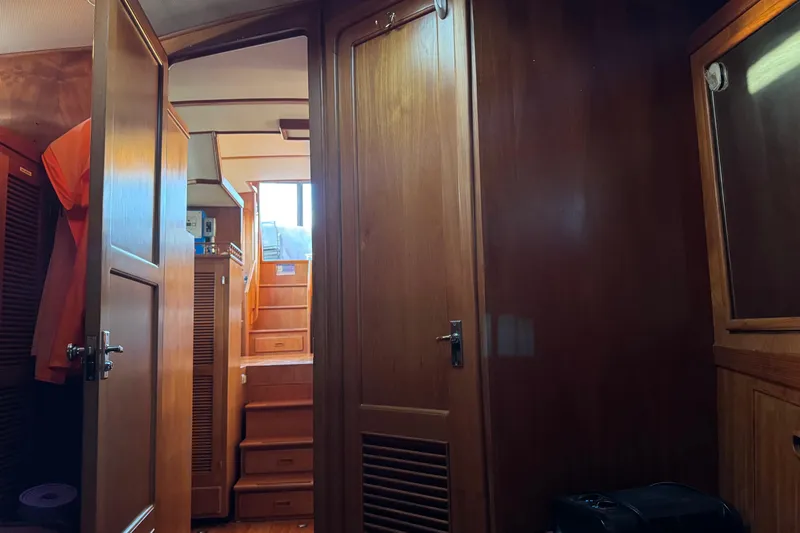 Slide: The Image of Interior of a 1987 President 37 yacht with wooden paneling and stairs. - 43