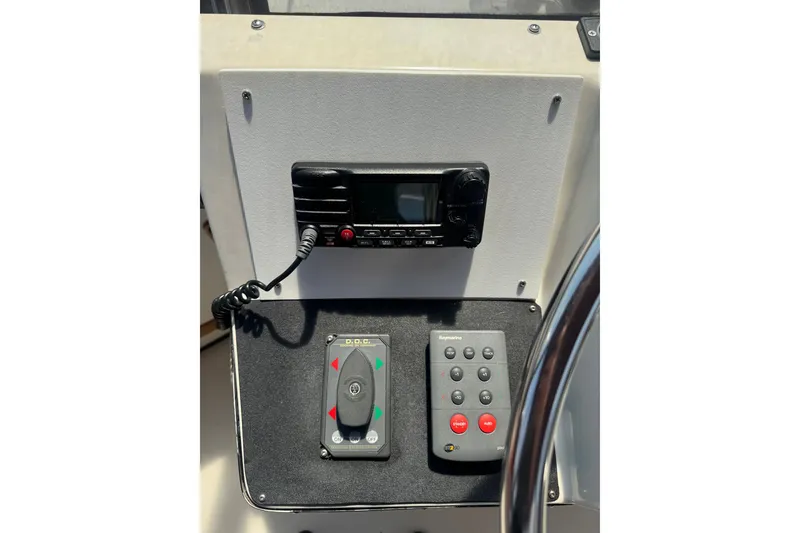 Slide: The Image of Control panel of a 1987 President 37 boat with radio and navigation controls. - 66