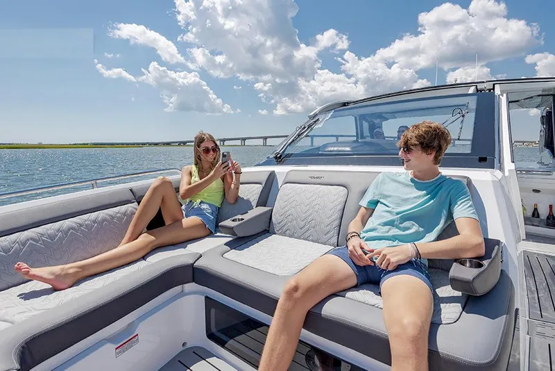 Slide: The Image of Manufacturer Provided Image: Two people relaxing on a 2025 Galeon 375 GTO yacht under a sunny sky. - 3