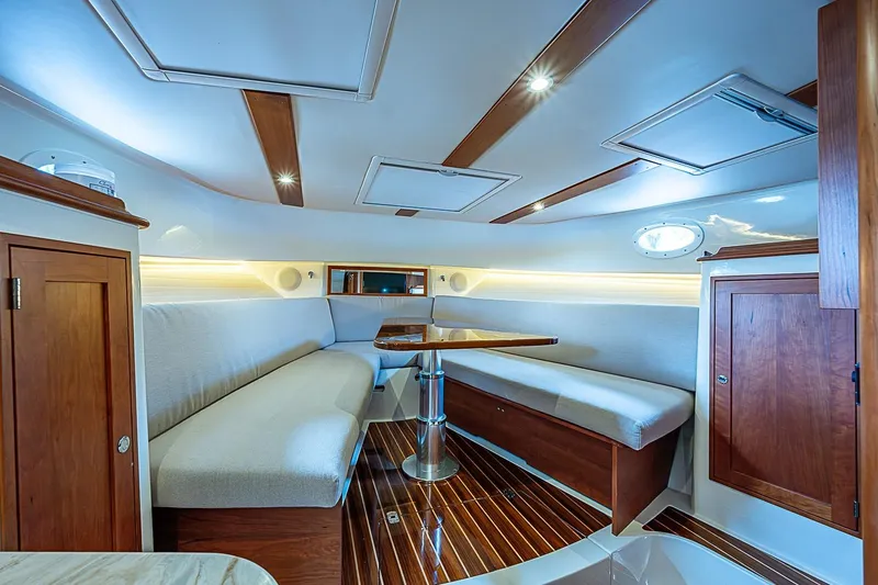 Slide: The Image of Luxurious interior of 2023 Hinckley Sport Boat 40 X with elegant wood finishes. - 22