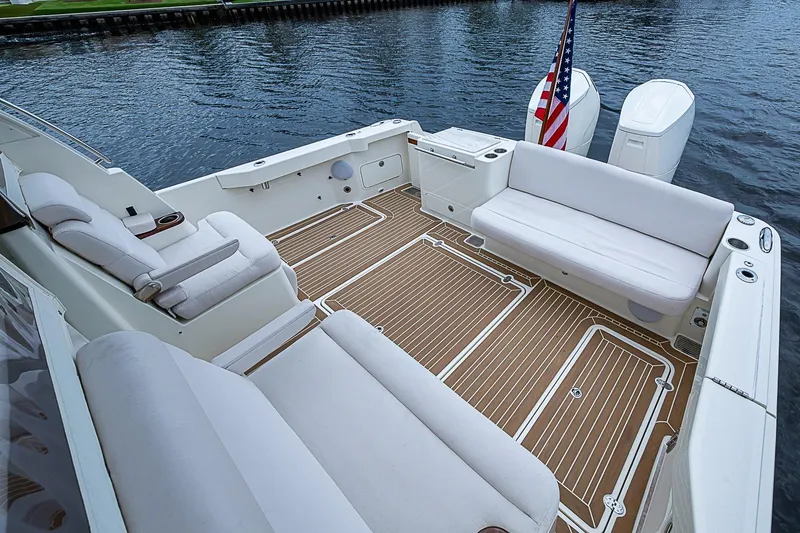 Slide: The Image of 2023 Hinckley Sport Boat 40 X with spacious seating and elegant deck design. - 6