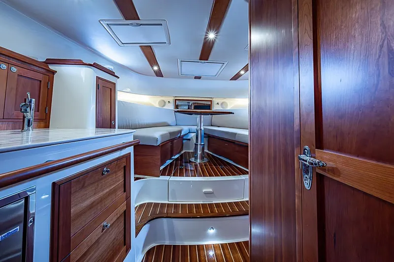 Slide: The Image of Luxurious interior of 2023 Hinckley Sport Boat 40 X with elegant wood finishes. - 23