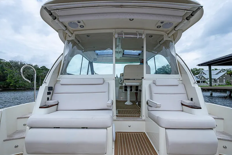 Slide: The Image of 2023 Hinckley Sport Boat 40 X interior with plush seating and modern design. - 12
