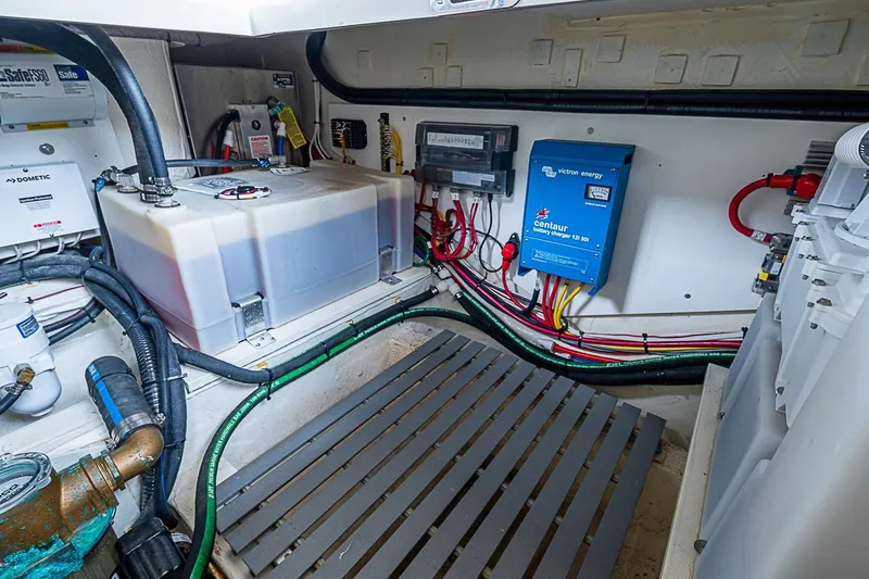 Slide: The Image of Engine room of 2023 Hinckley Sport Boat 40 X with electrical components and wiring. - 27